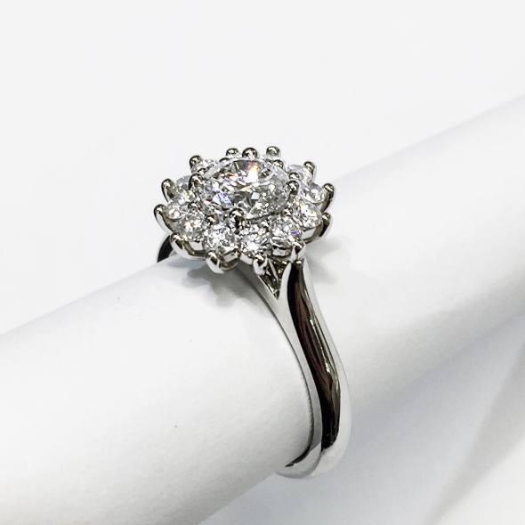 Round Brilliant Cut Diamond in a Snowflake Halo Design