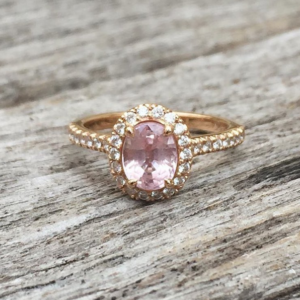 Oval Pink Sapphire in a Rose Gold and Diamond Halo Design