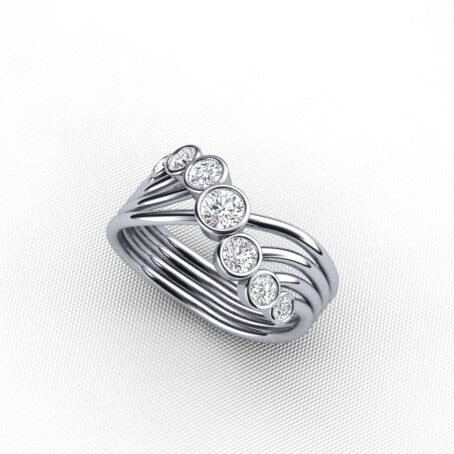 Contemporary Seven Stone Ring Featuring Bezel Set Round Brilliant Cut Diamonds