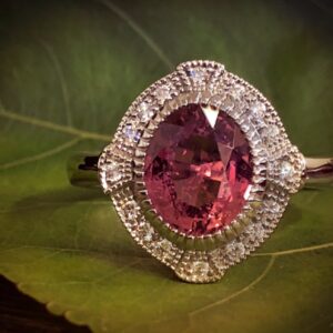 Oval Berry Coloured Sapphire in a Vintage Inspired Halo Design Ring