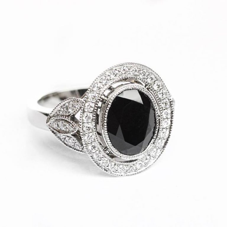 Oval Black Spinel in a Vintage Style Halo Design with Leaf Detail Shoulders