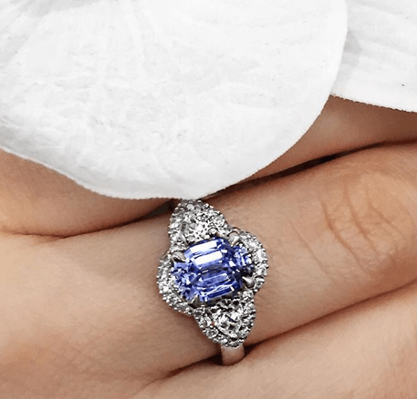 A diamond engagement ring featuring a Ceylon sapphire