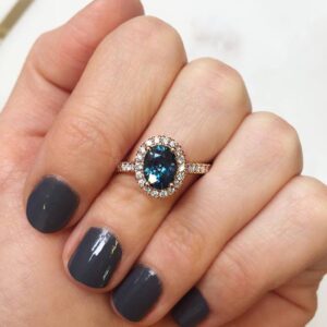 Teal Sapphire Halo Design Ring in Rose Gold