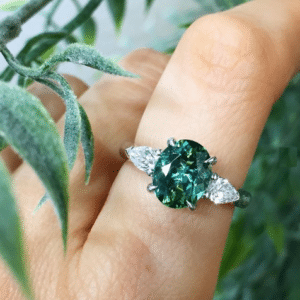 Oval Teal Tourmaline and Two Pear Shaped Diamonds in a Three Stone Design