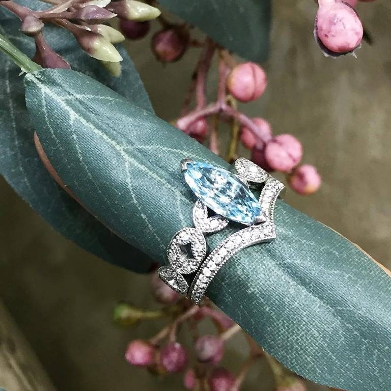 Marquise Cut Aquamarine Ring with Diamond Set Shoulders and V Shaped Diamond Wedding Ring