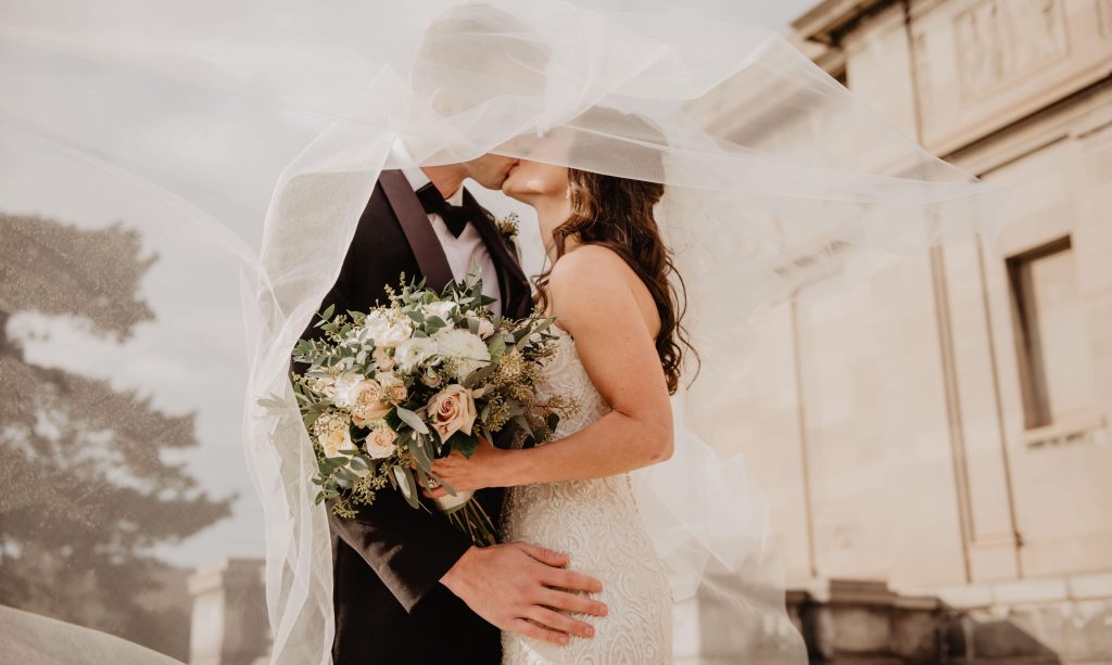 bride and groom kissing