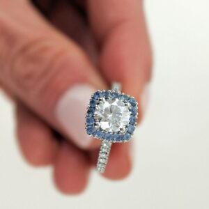 Round Brilliant Cut Diamond Surrounded by a Blue Sapphire Halo