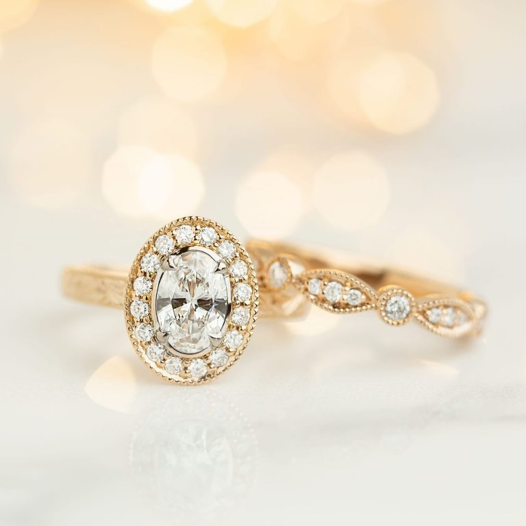 Oval Diamond Halo Design Engagement Ring with a Matching Diamond Set Wedding Ring