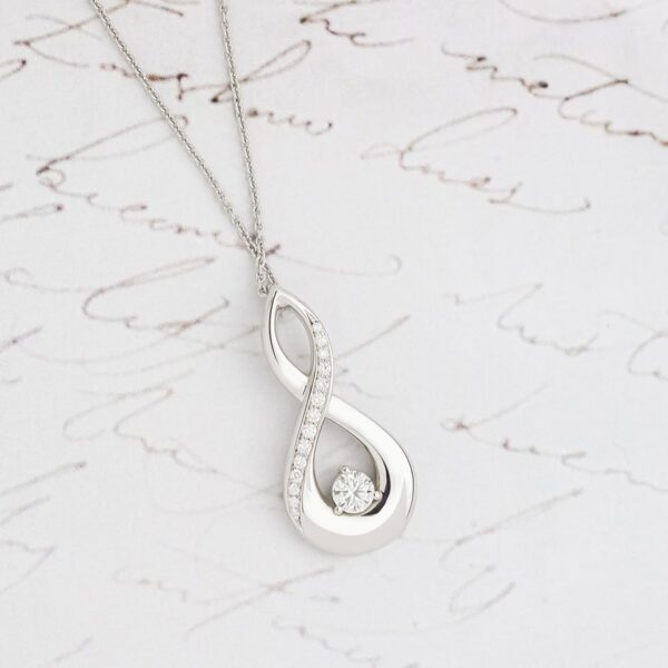 Twist Design Diamond Pendant with Grain Set Diamonds