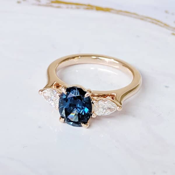 oval teal sapphire ring