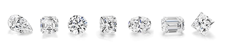 Collection of diamonds in different shapes such as round brilliant, princess, cushion, oval and pear