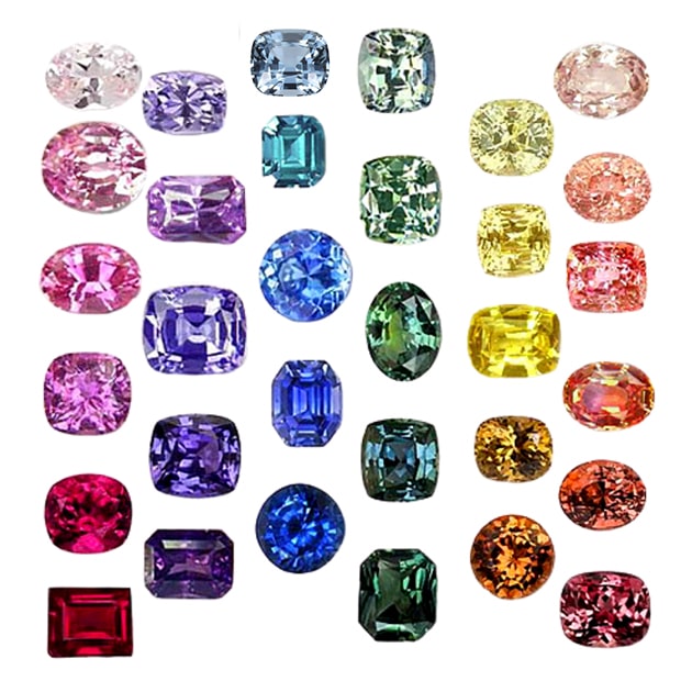 A collection of sapphires and rubies displaying a range of colours including blue, red, pink, green