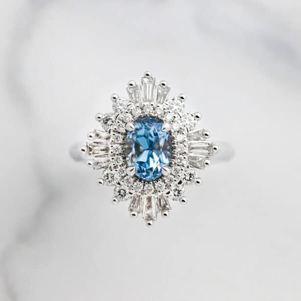 Aquamarine and diamond unique halo engagement ring