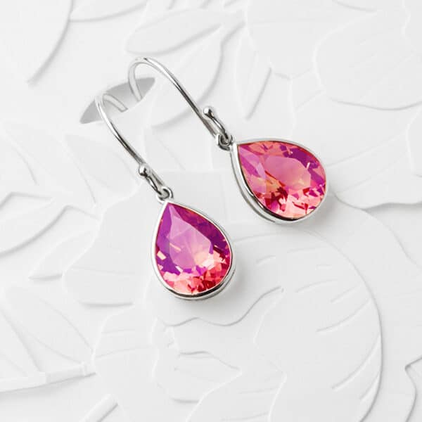 Vibrant pink sapphire earrings in a platinum setting