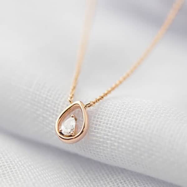 Rose Gold tear shape pendant with pear diamond centre stone