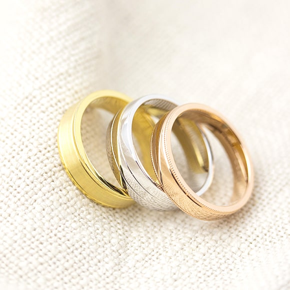 Three custom made wedding rings in white gold, rosegold and yellowgold.