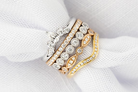 Stack of custom made wedding rings in white gold, platinum, rose gold and yellow gold made in Australia