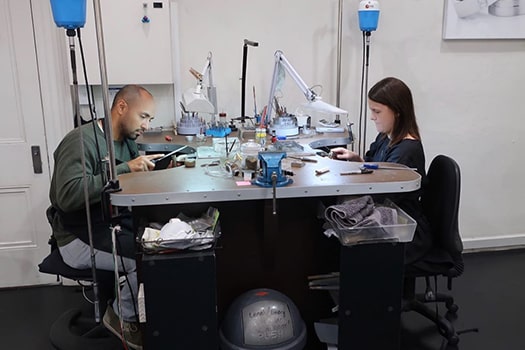 Couples enjoying working in the studio at the Larsen Wedding ring experience, where you can make your own wedding rings.