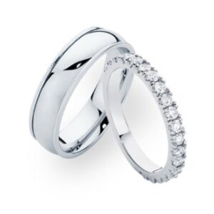 A set of mens and womens wedding rings in white gold with diamonds