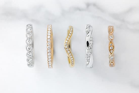 A row of bespoke eternity rings that are custom made to fit with your engagemnt and wedding ring.