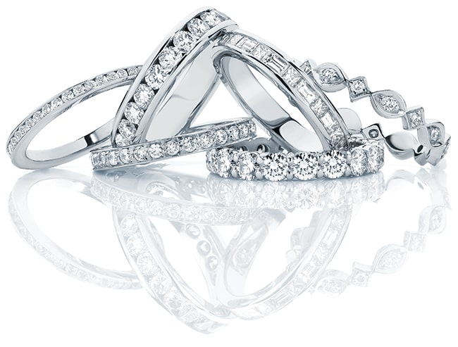 A collection of unique and classic diamond encrusted eternity rings in white gold and platinum