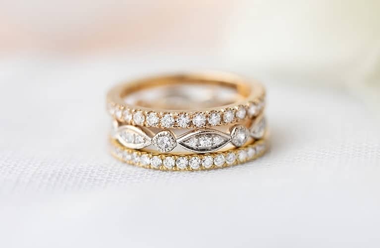 Stack of rose gold white gold and yellow gold wedding rings made in Sydney