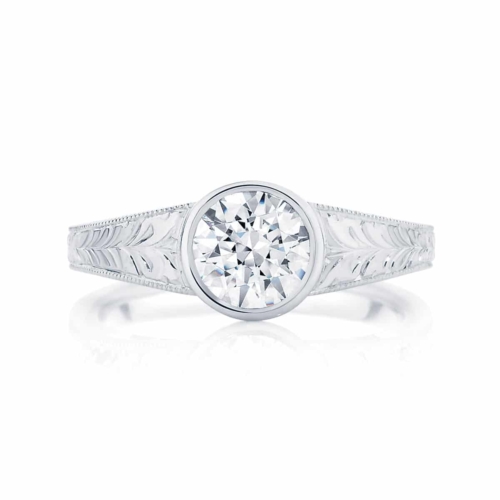 An engraved band solitaire bezel set diamond engagement ring called Empress from Larsen Jewellery.