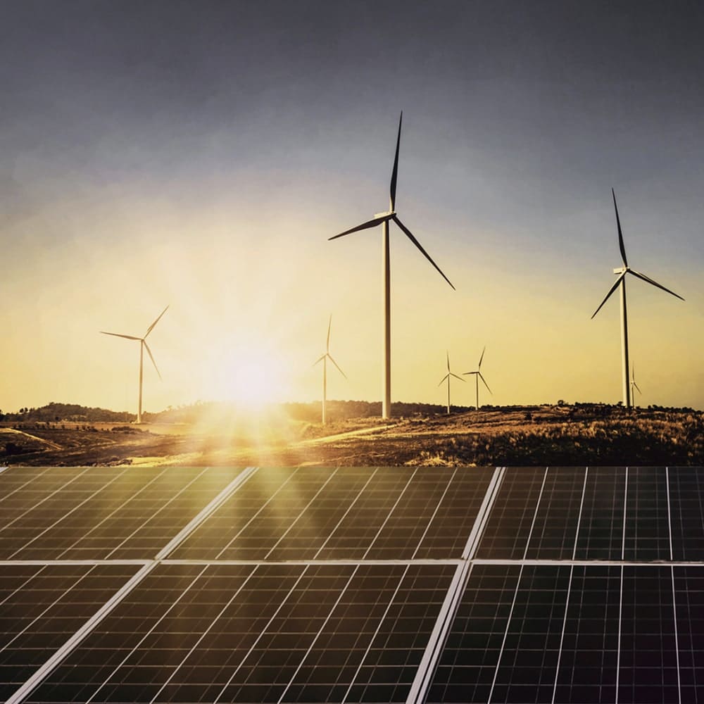 Wind turbines in a field, reducing the carbon footprint of Larsen Jewellery