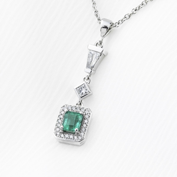 Emerald Pendant with a Diamond Halo and a Baguet and Princess Cut Feature