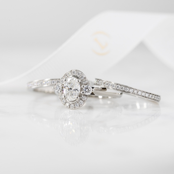 Oval diamond halo ring and wedding bands