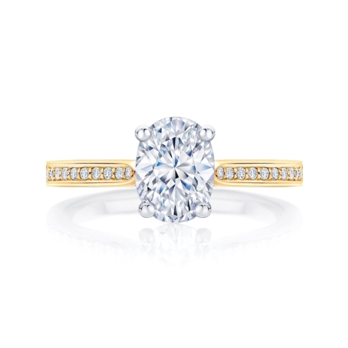 Oval diamond engagement ring yellow gold with side stones