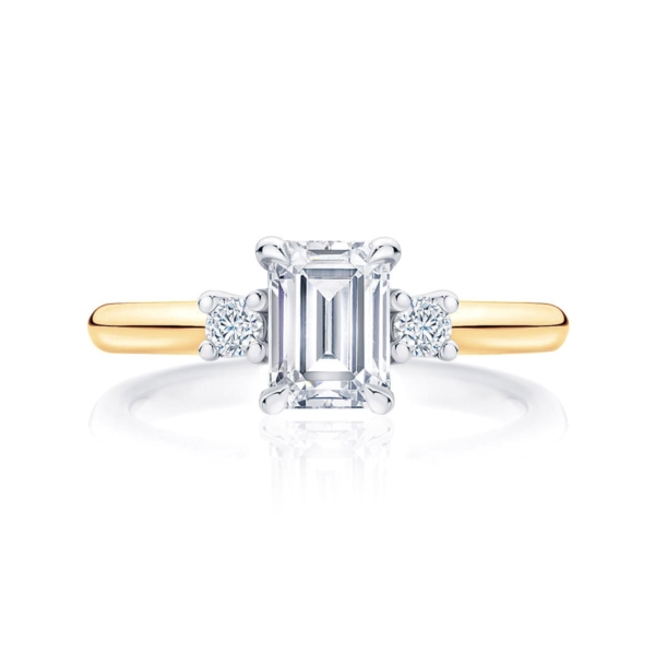 Emerald cut diamond three stone engagement ring yellow gold