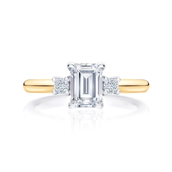 Emerald cut diamond three stone engagement ring yellow gold