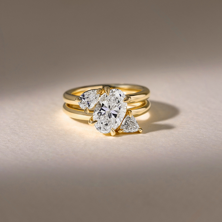 engagement ring for Sydney Melbourne and Brisbane with 18 carat yellow gold band and a oval diamond as a centre stone