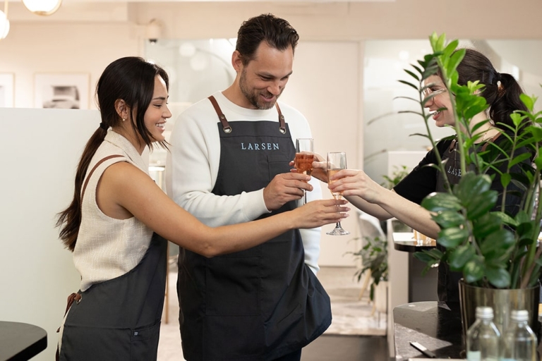 Couple making their own wedding rings with the help of an expert jeweller at Larsen