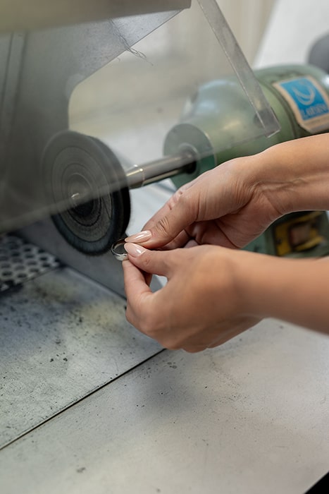 Client learning to make a wedding ring for his future wife in the make your own wedding ring experience at Larsen.
