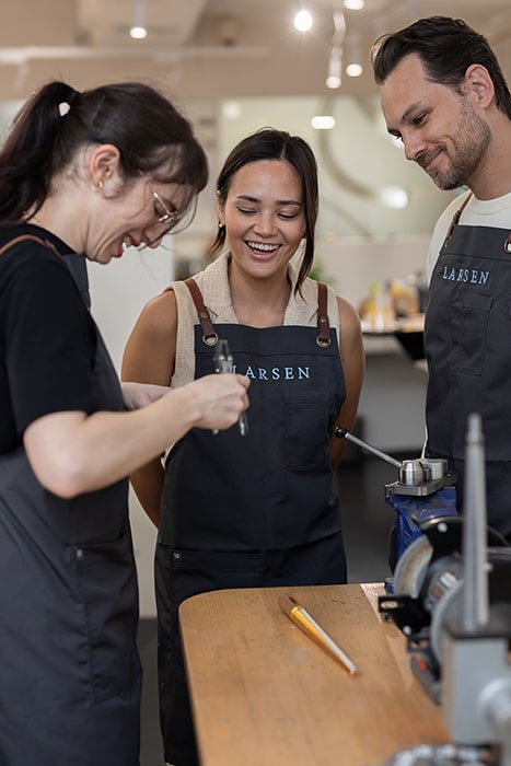 Jeweller helping client to make a wedding ring during the Larsen make your own wedding ring experience.