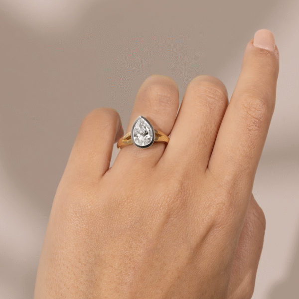 Pear Shaped Diamond with a Bezel Setting and a Split Band